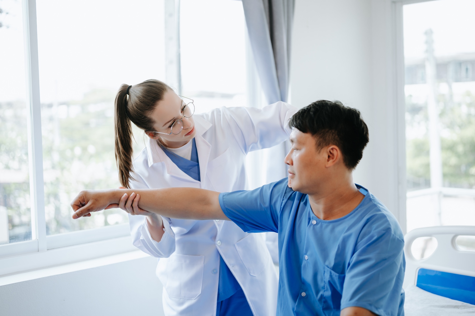 Doctor consulting with patient Back problems Physical therapy concept